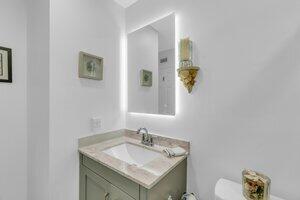 504 Davis Road, Unit 86 Palm Springs, FL 33461 - Photo 25 of 25 a bathroom with a sink and a mirror