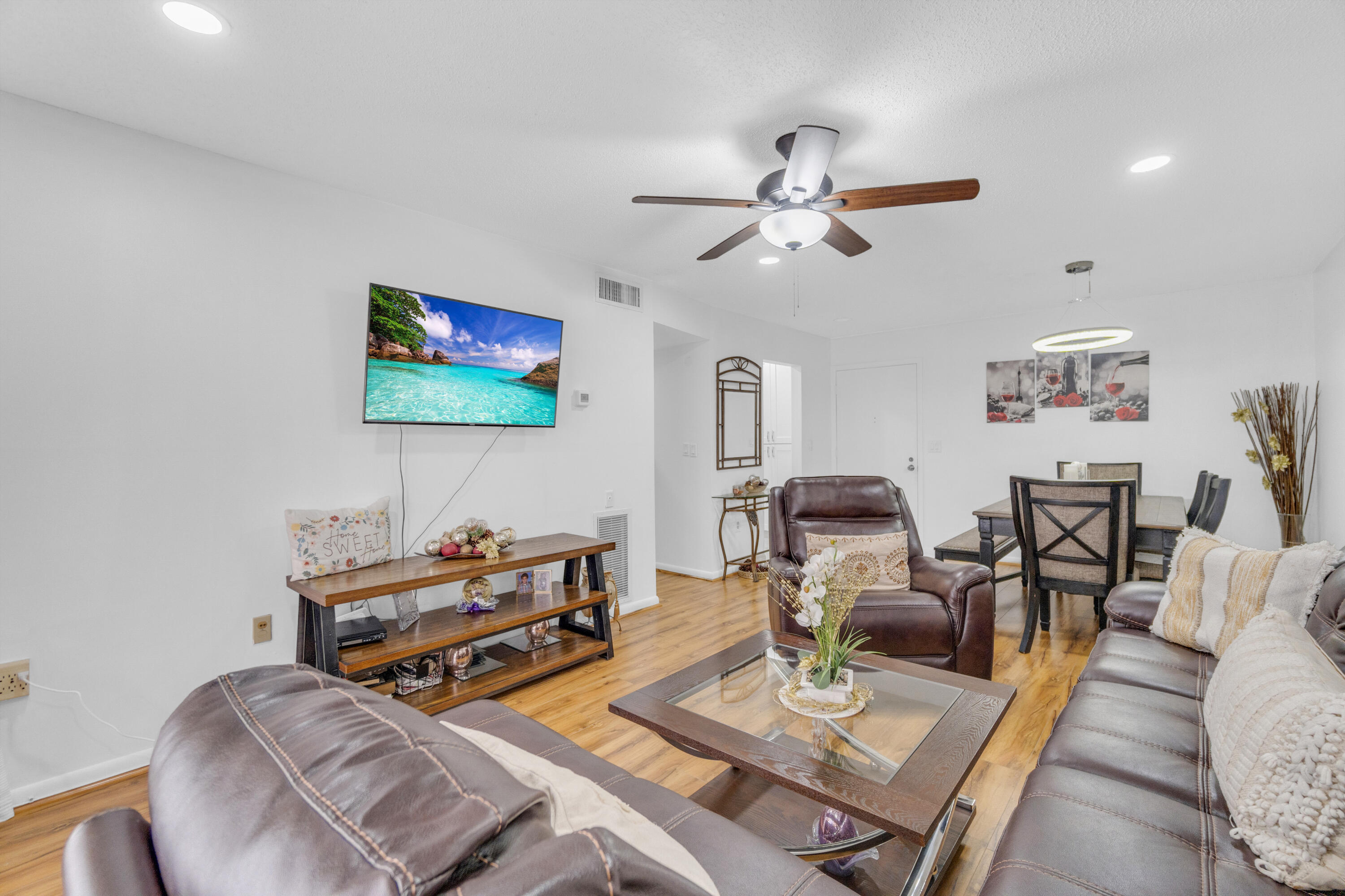 504 Davis Road, Unit 86 Palm Springs, FL 33461 - Photo 6 of 25 a living room with furniture and a flat screen tv