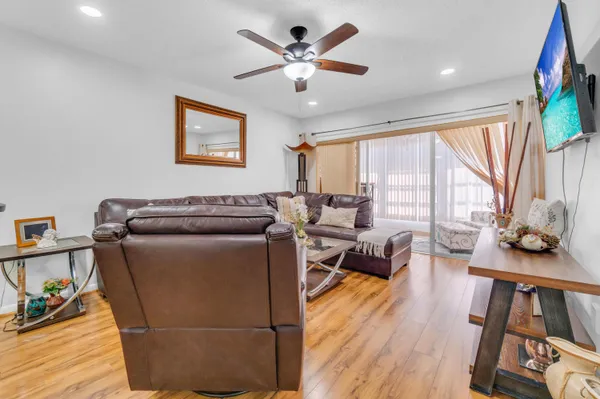 a living room with furniture and a large window