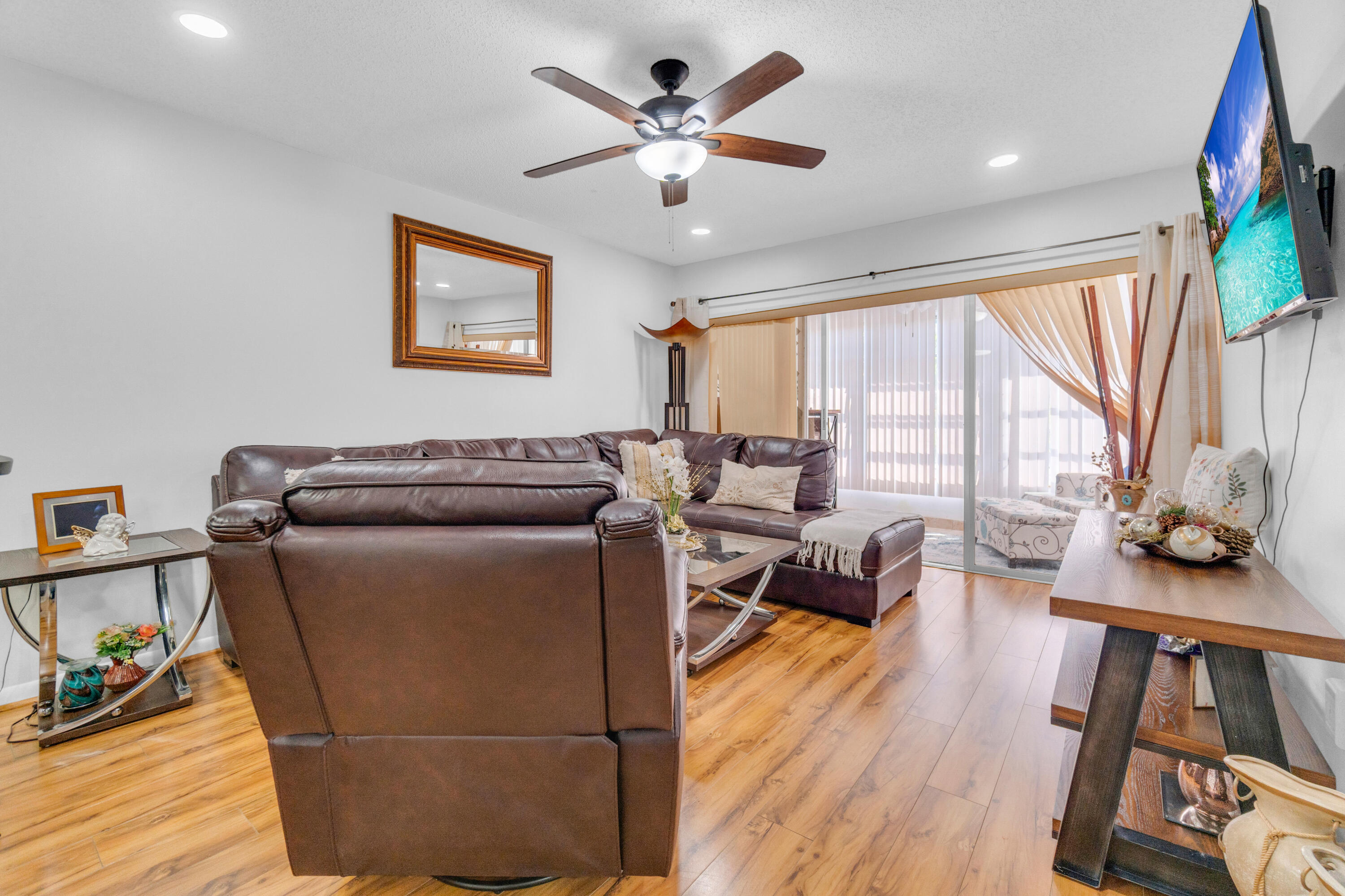 504 Davis Road, Unit 86 Palm Springs, FL 33461 - Photo 7 of 25 a living room with furniture and a large window