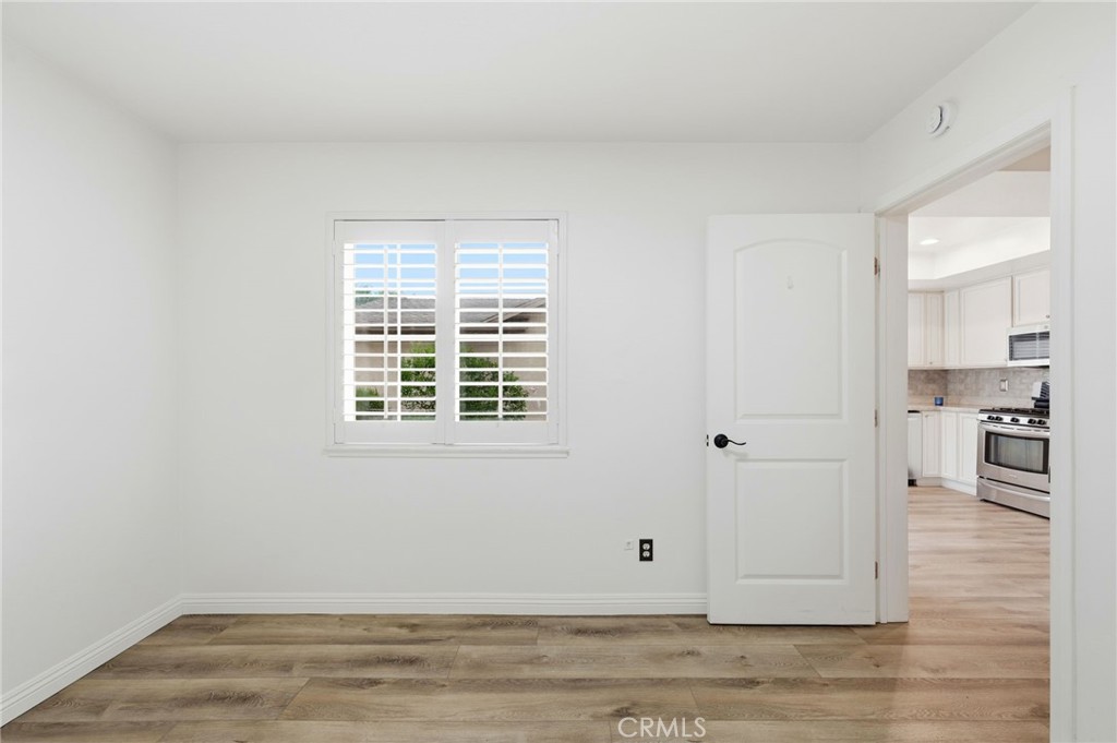 25868 Alegro Drive Valencia, CA 91355 - Photo 14 of 35 a view of livingroom with hardwood floor and a kitchen