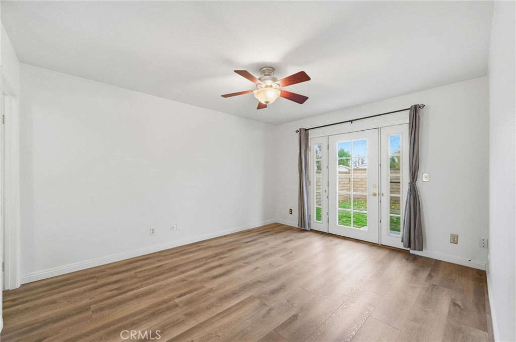 25868 Alegro Drive Valencia, CA 91355 - Photo 15 of 35 a view of an empty room with window and wooden floor
