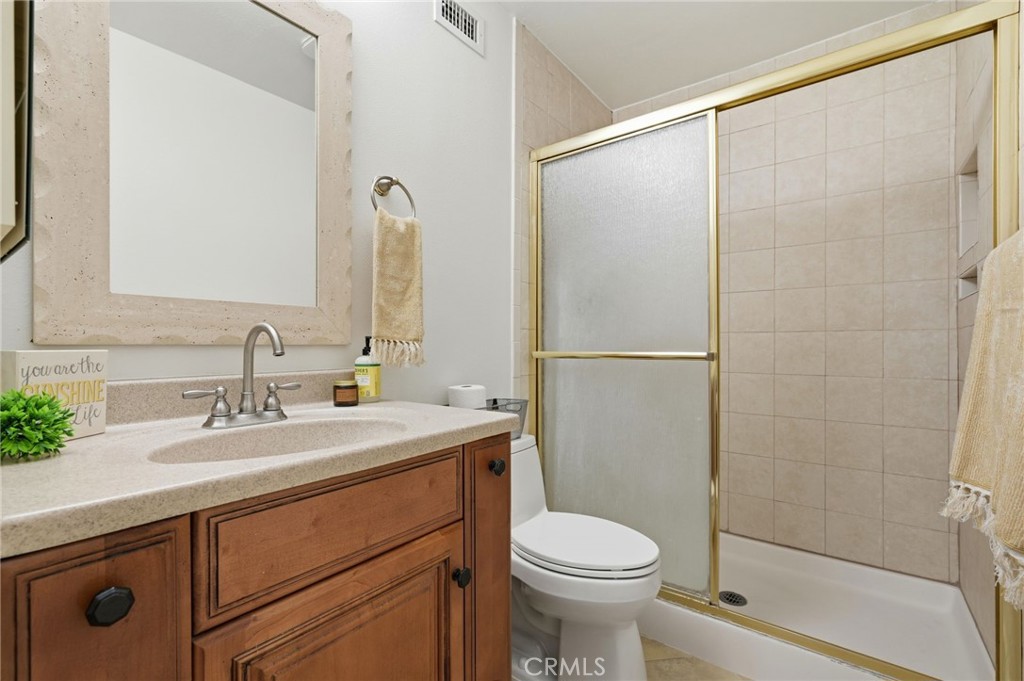 25868 Alegro Drive Valencia, CA 91355 - Photo 22 of 35 a bathroom with a sink a toilet and shower