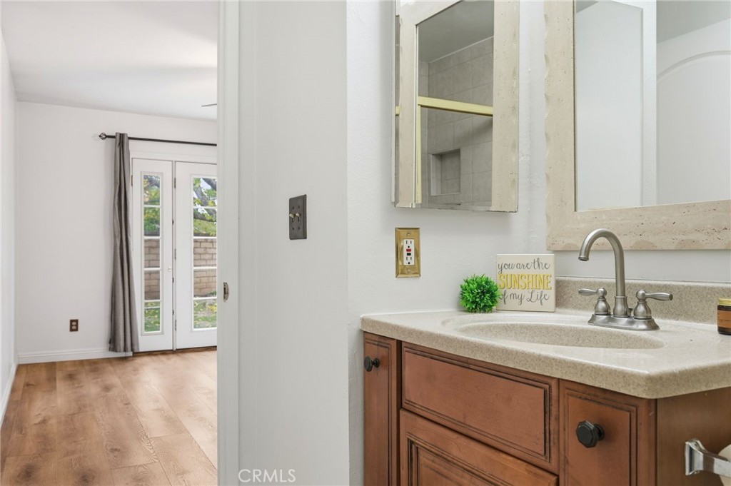 25868 Alegro Drive Valencia, CA 91355 - Photo 23 of 35 a bathroom with a sink and a mirror