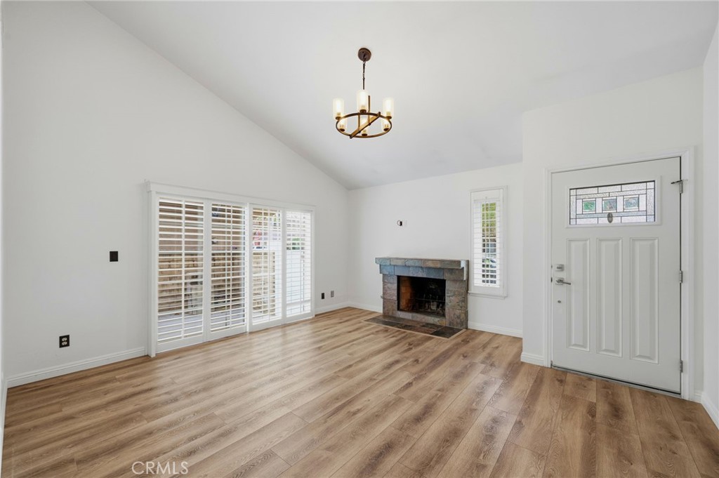 25868 Alegro Drive Valencia, CA 91355 - Photo 4 of 35 a view of an empty room with wooden floor and a window