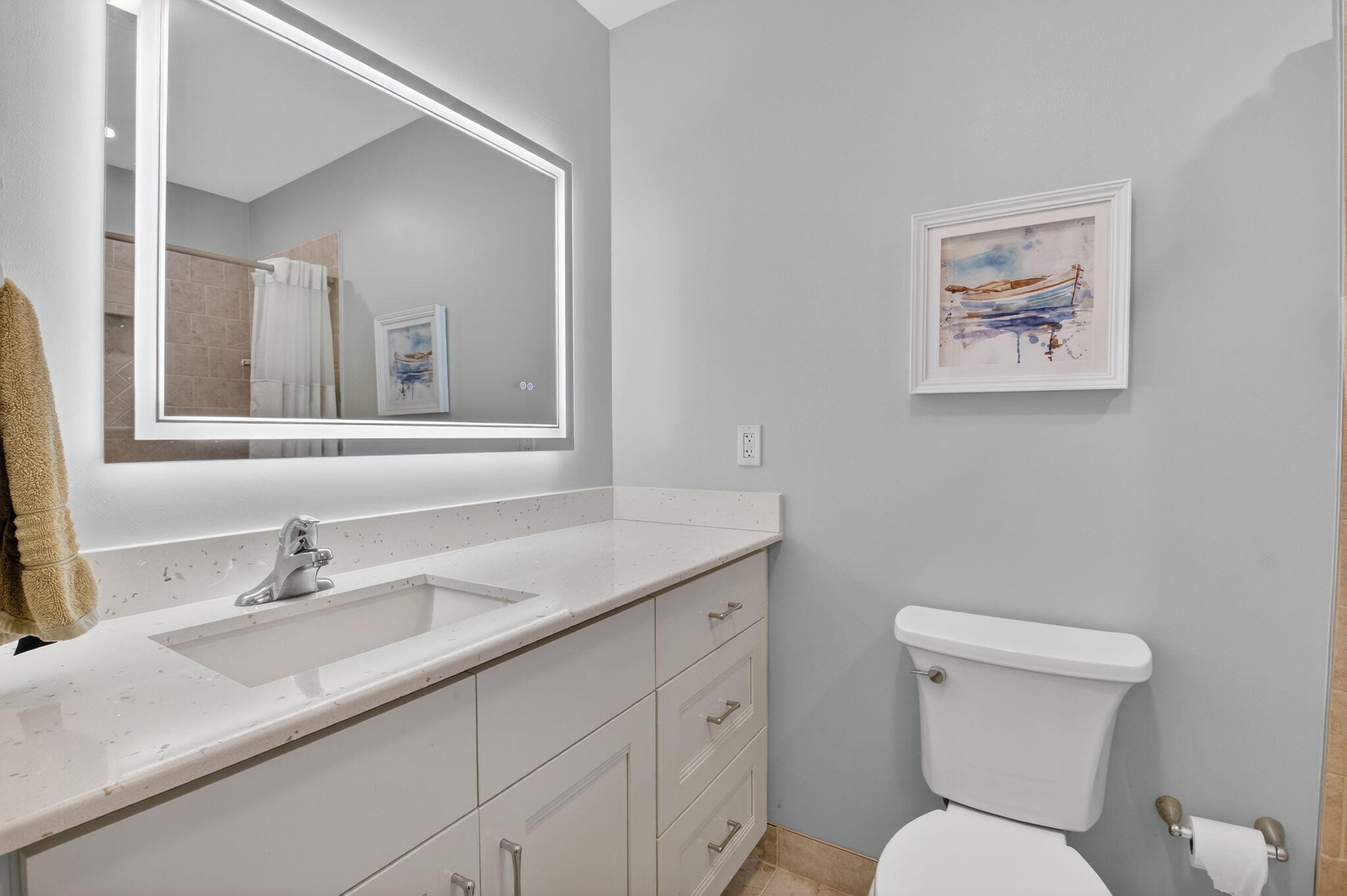 1390 High Point Way Southwest, Unit D Delray Beach, FL 33445 - Photo 11 of 39 a bathroom with a toilet sink and mirror