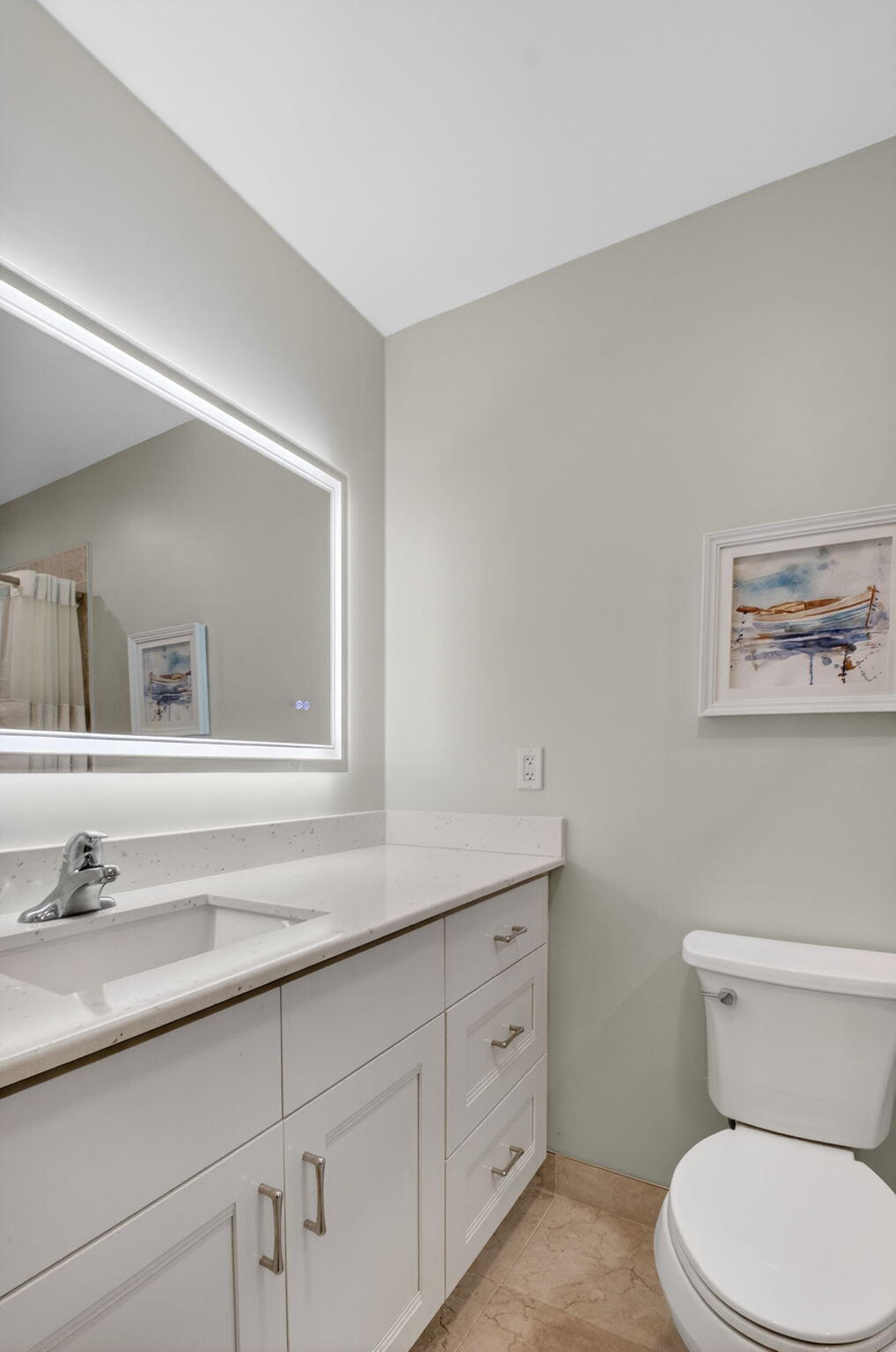 1390 High Point Way Southwest, Unit D Delray Beach, FL 33445 - Photo 12 of 39 a bathroom with a toilet a sink and mirror