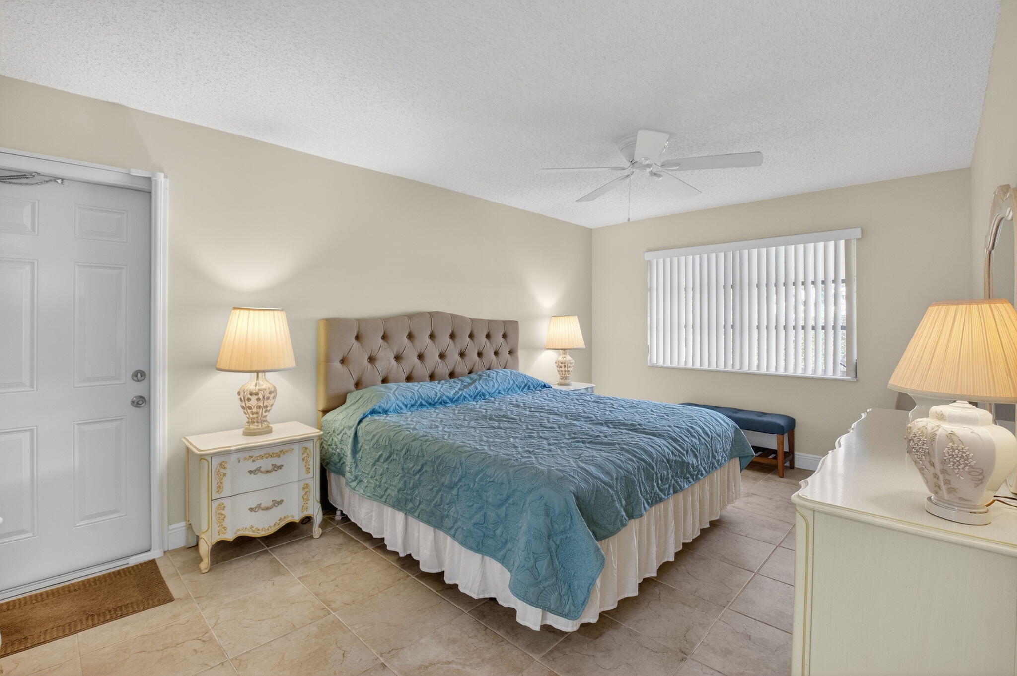 1390 High Point Way Southwest, Unit D Delray Beach, FL 33445 - Photo 14 of 39 a bedroom with a bed and a window