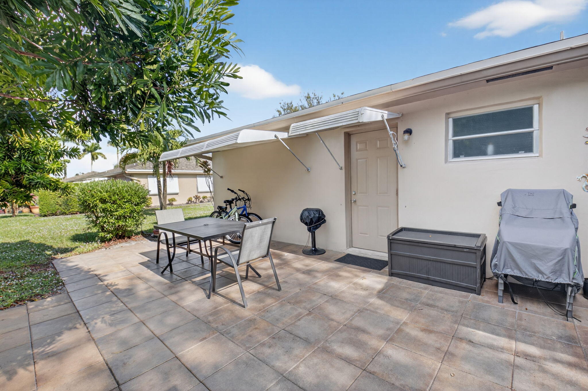 1390 High Point Way Southwest, Unit D Delray Beach, FL 33445 - Photo 22 of 39 a outdoor space with a couch and chairs