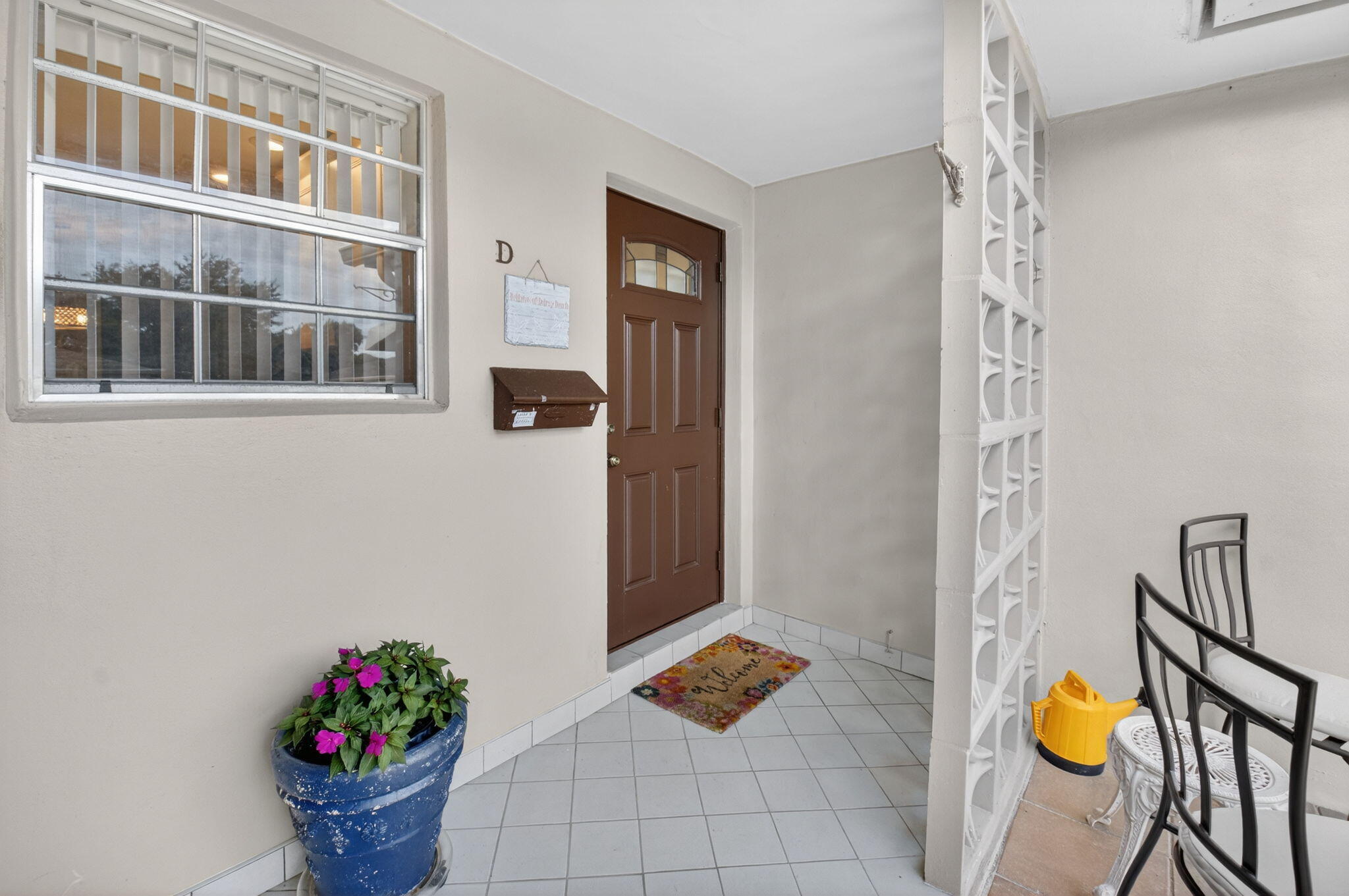 1390 High Point Way Southwest, Unit D Delray Beach, FL 33445 - Photo 3 of 39 a bathroom with a sink and mirror