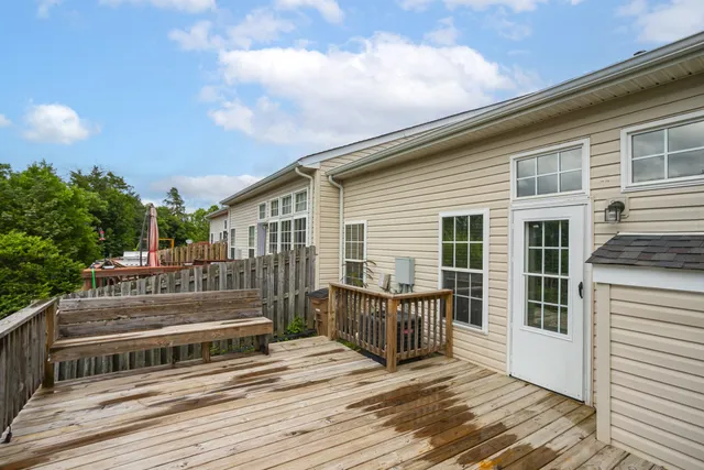 a view of a swimming pool with an outdoor seating