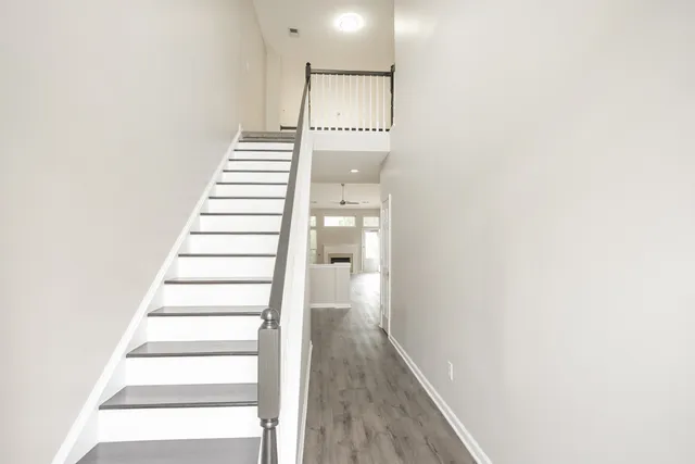 a view of a hallway with staircase
