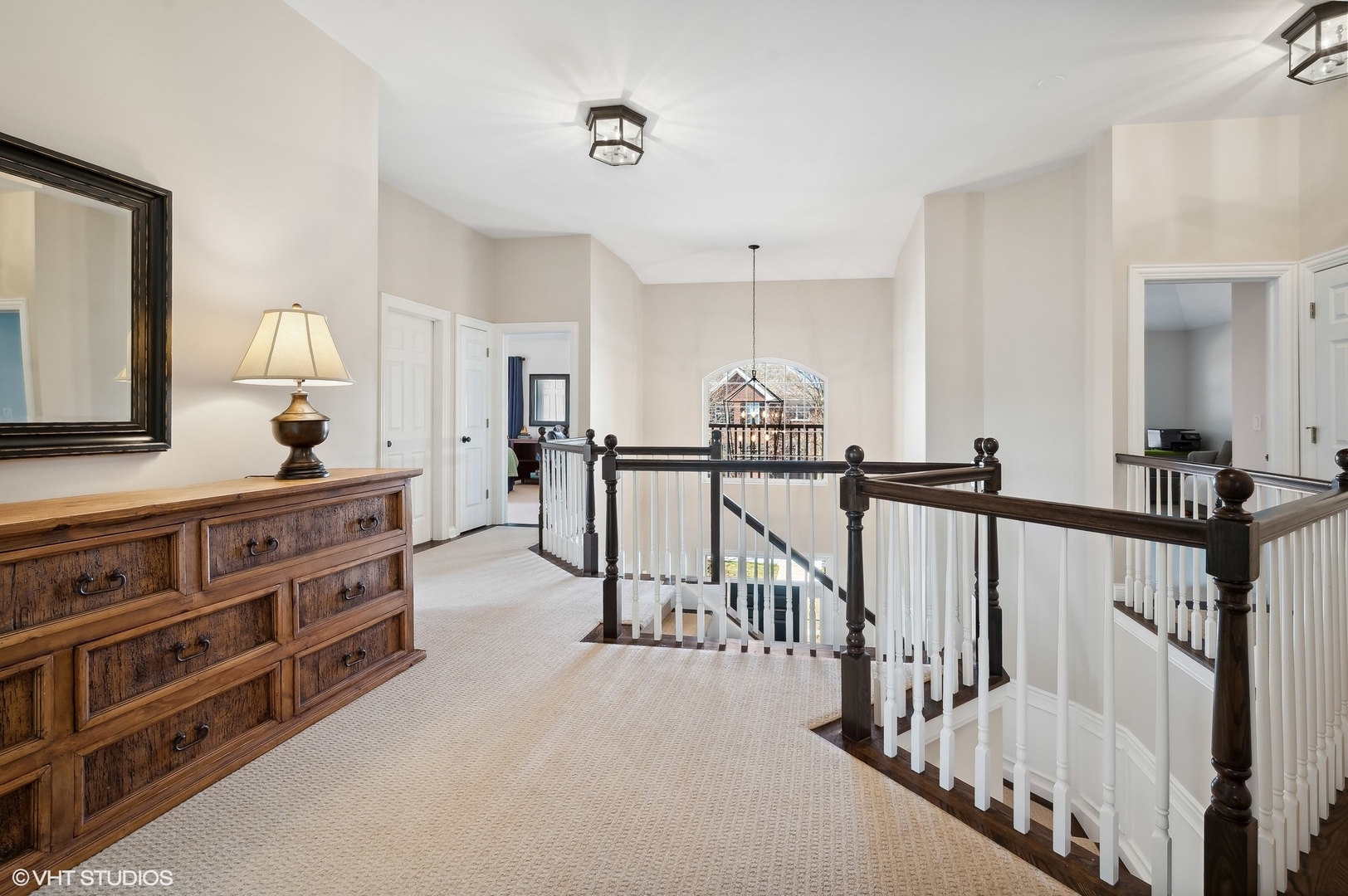 1619 Annapolis Drive Glenview, IL 60026 - Photo 22 of 43 a view of a hallway with two mirror and furniture