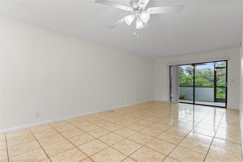 3130 Millwood Terrace, Unit 115 Boca Raton, FL 33431 - Photo 11 of 34 a view of an empty room with a window