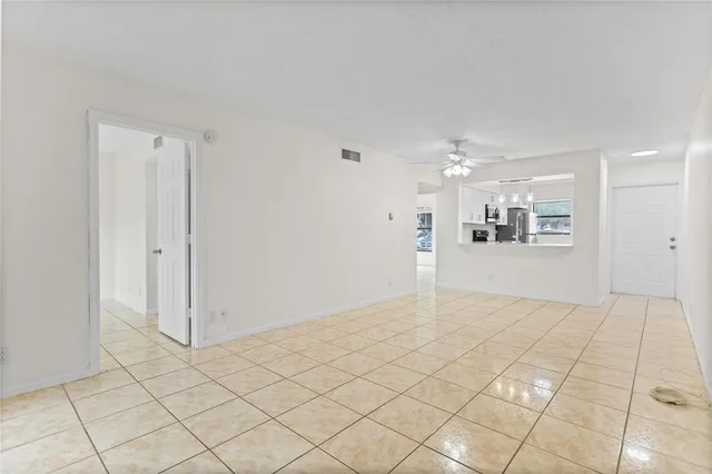 a view of a big room with closet and windows