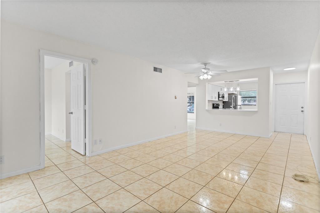 3130 Millwood Terrace, Unit 115 Boca Raton, FL 33431 - Photo 12 of 34 a view of a big room with closet and windows