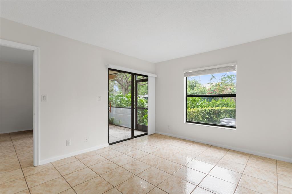 3130 Millwood Terrace, Unit 115 Boca Raton, FL 33431 - Photo 13 of 34 a view of an empty room with a window