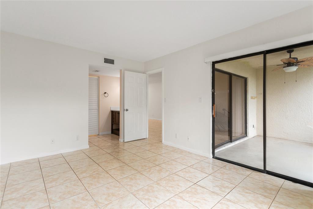 3130 Millwood Terrace, Unit 115 Boca Raton, FL 33431 - Photo 14 of 34 a view of a room with an empty space and wooden floor