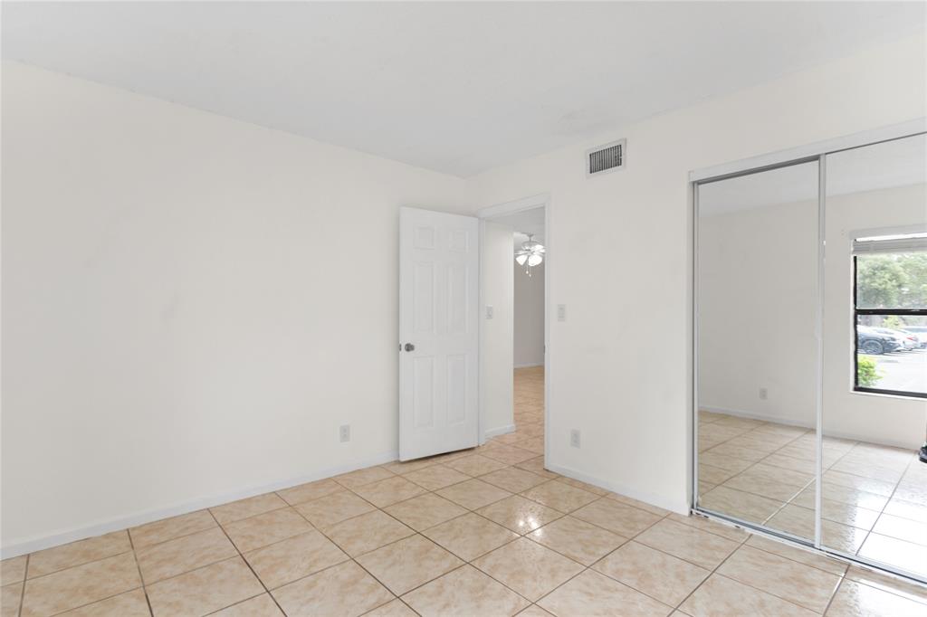 3130 Millwood Terrace, Unit 115 Boca Raton, FL 33431 - Photo 16 of 34 a view of an empty room and window