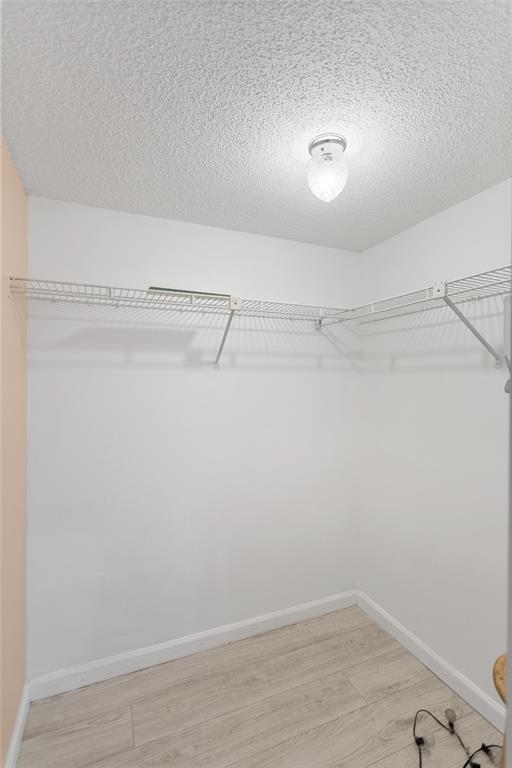 3130 Millwood Terrace, Unit 115 Boca Raton, FL 33431 - Photo 17 of 34 a view of a room with racks on the wall
