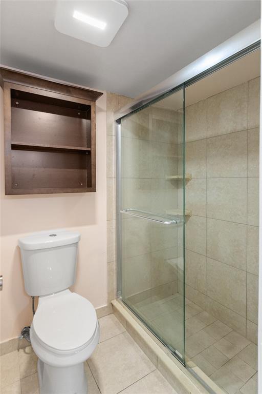 3130 Millwood Terrace, Unit 115 Boca Raton, FL 33431 - Photo 20 of 34 a bathroom with a toilet and a shower