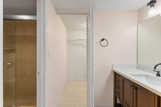 a bathroom with a sink and mirror