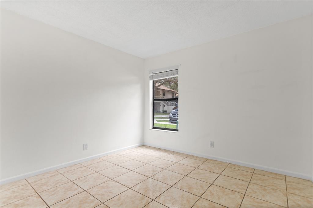 3130 Millwood Terrace, Unit 115 Boca Raton, FL 33431 - Photo 22 of 34 a view of an empty room and window