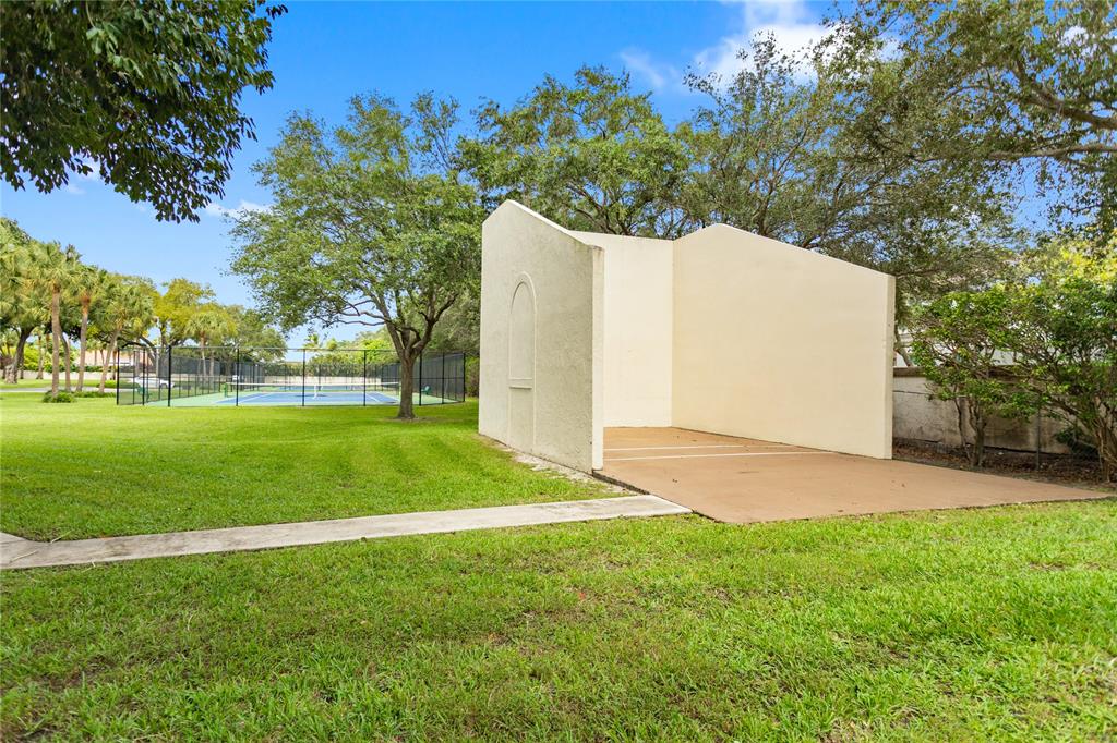 3130 Millwood Terrace, Unit 115 Boca Raton, FL 33431 - Photo 32 of 34 a view of a backyard