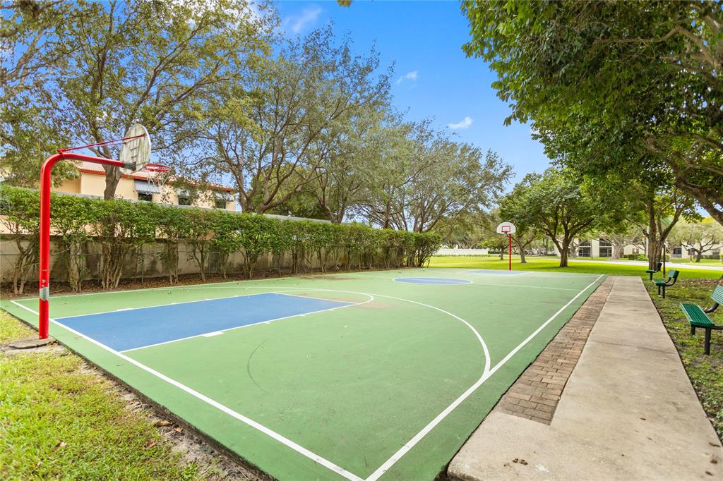 3130 Millwood Terrace, Unit 115 Boca Raton, FL 33431 - Photo 33 of 34 a view of a tennis court