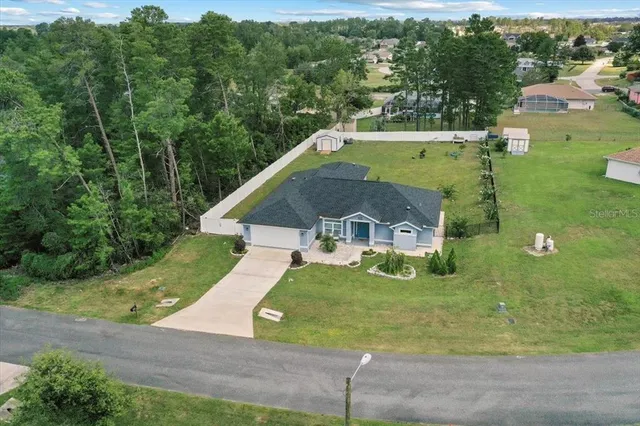 a front view of house with yard and entertaining space