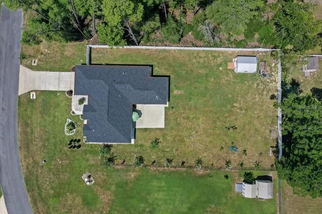 an aerial view of a house with a garden