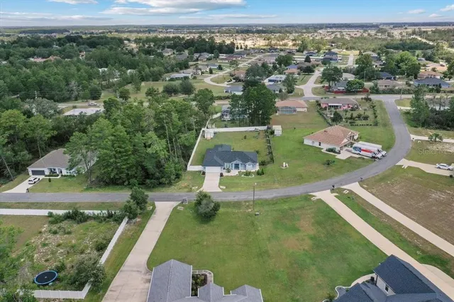 a balcony with furniture and a potted plant