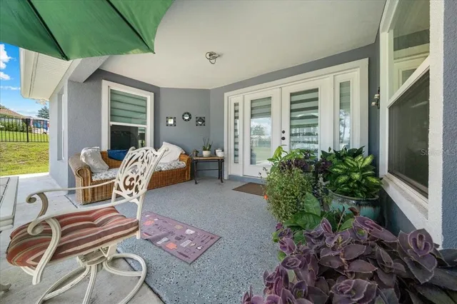 a kitchen with stainless steel appliances kitchen island granite countertop a refrigerator and microwave