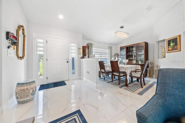 a living room with furniture and a table