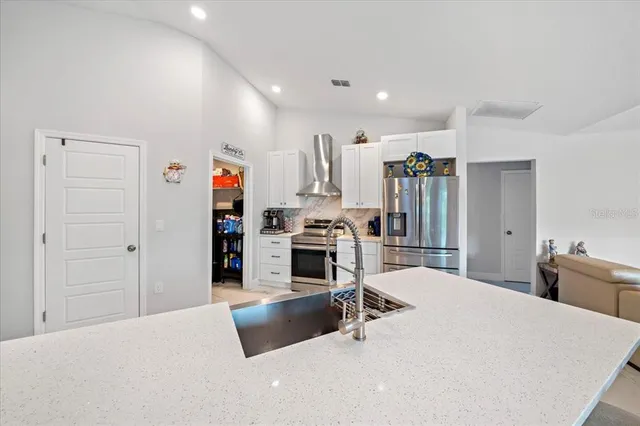 a bedroom with a bed and dresser