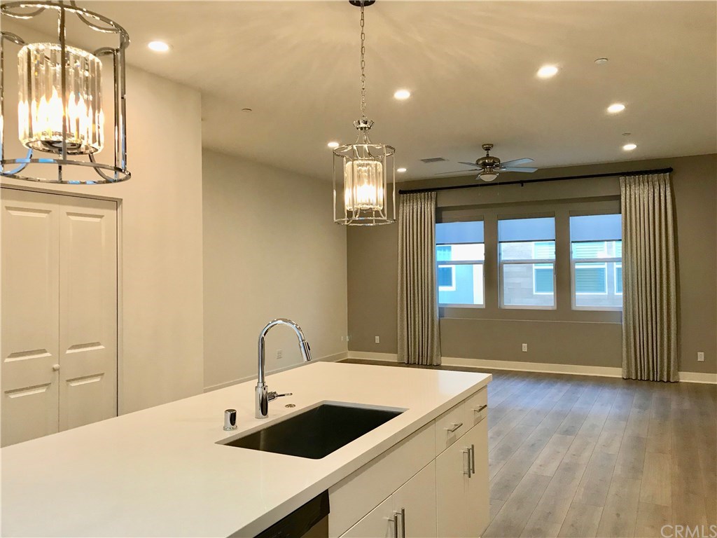 Upgraded!!! Turnkey, Turnkey, Turnkey. Upgraded wood flooring throughout, Elegant Pendant Lights, Painted Accent Wall, Custom Drapes & Coordinating Window Shades & Ceiling Fan. Great Room is pre-wired for universal multimedia.