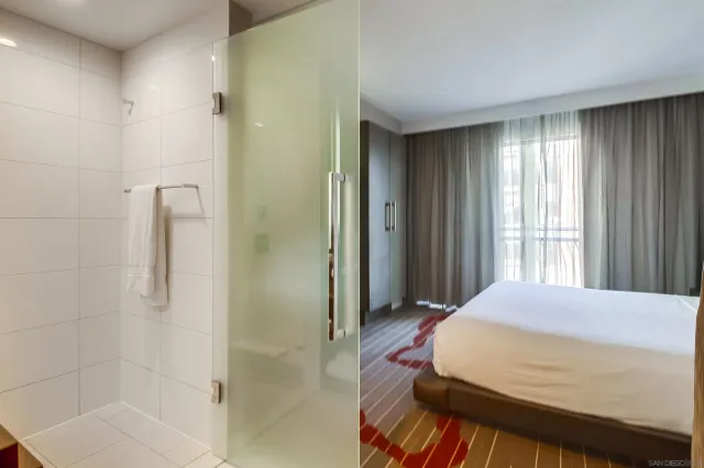 a bedroom with a bed and a shower