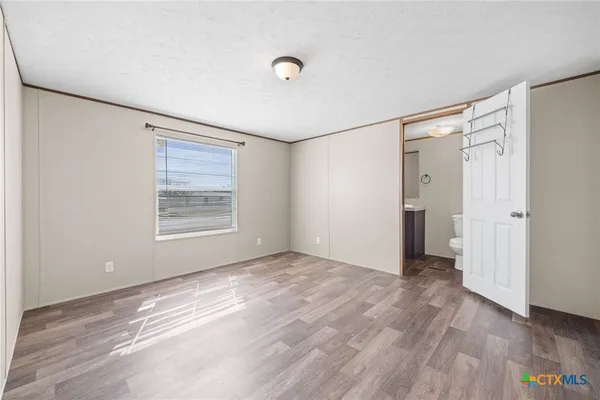 a bathroom with a granite countertop sink a toilet and a bathtub