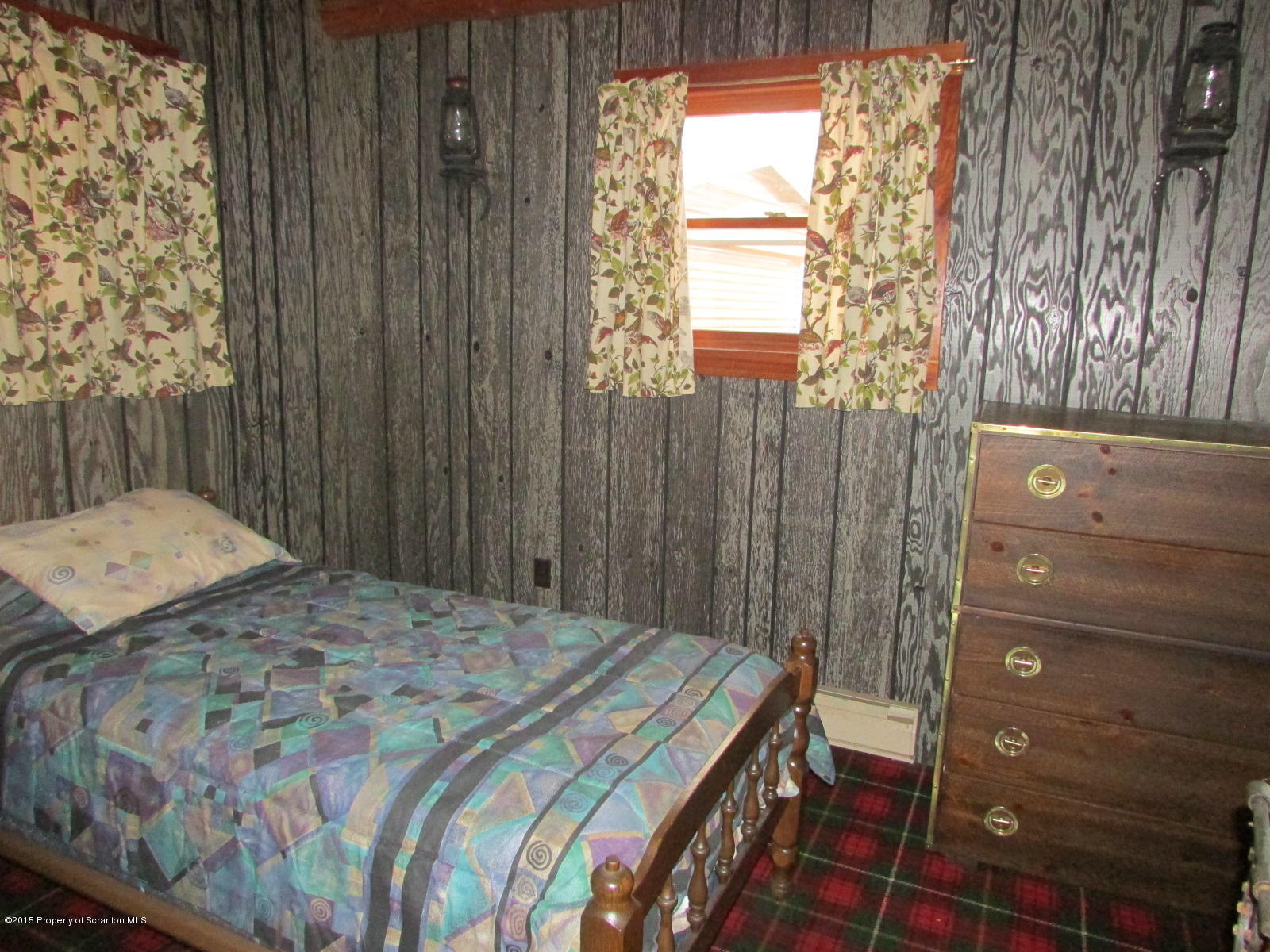 1291 Conroy Road Montrose, PA 18801 - Photo 11 of 34 a bedroom with a bed and a dresser