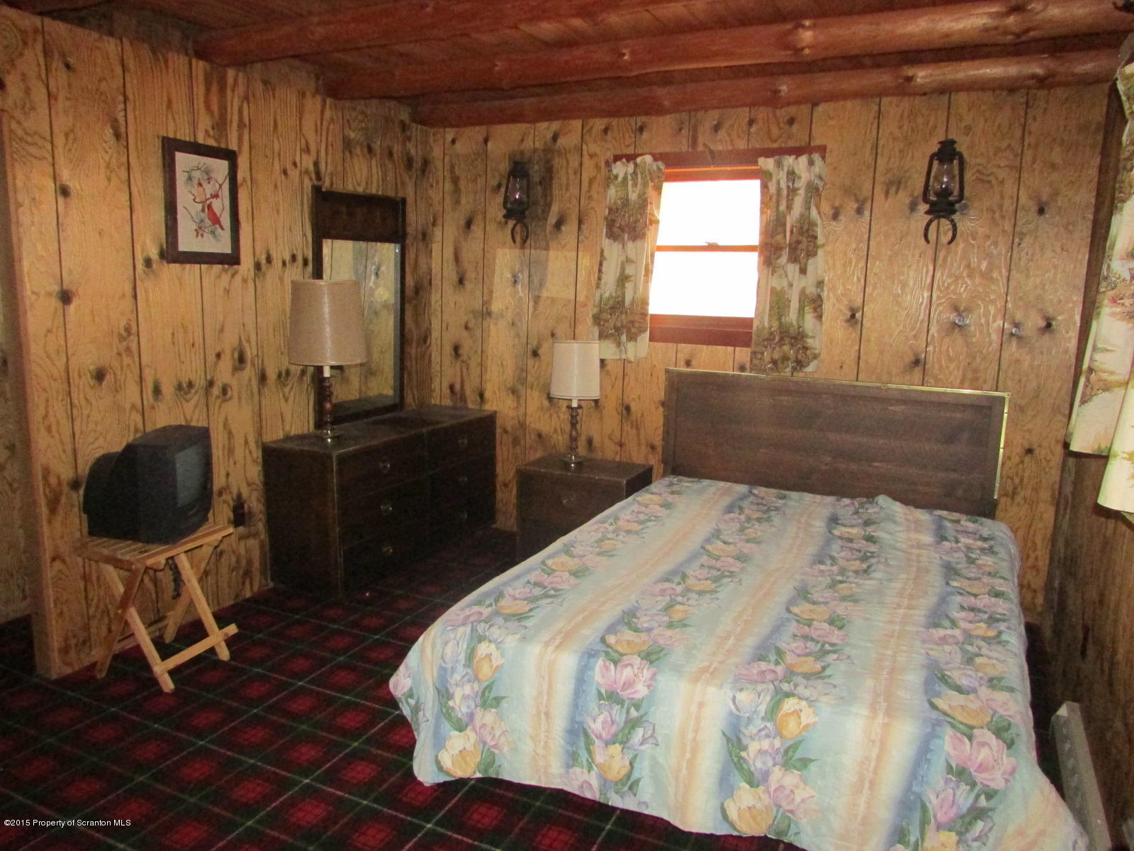 1291 Conroy Road Montrose, PA 18801 - Photo 12 of 34 a bedroom with a bed and glass table