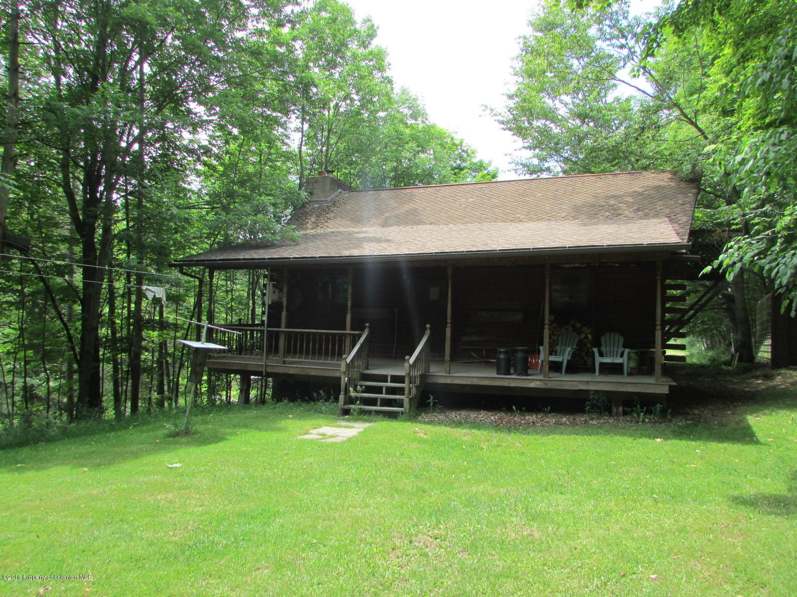 1291 Conroy Road Montrose, PA 18801 - Photo 26 of 34 an outdoor view of house with yard and outdoor seating