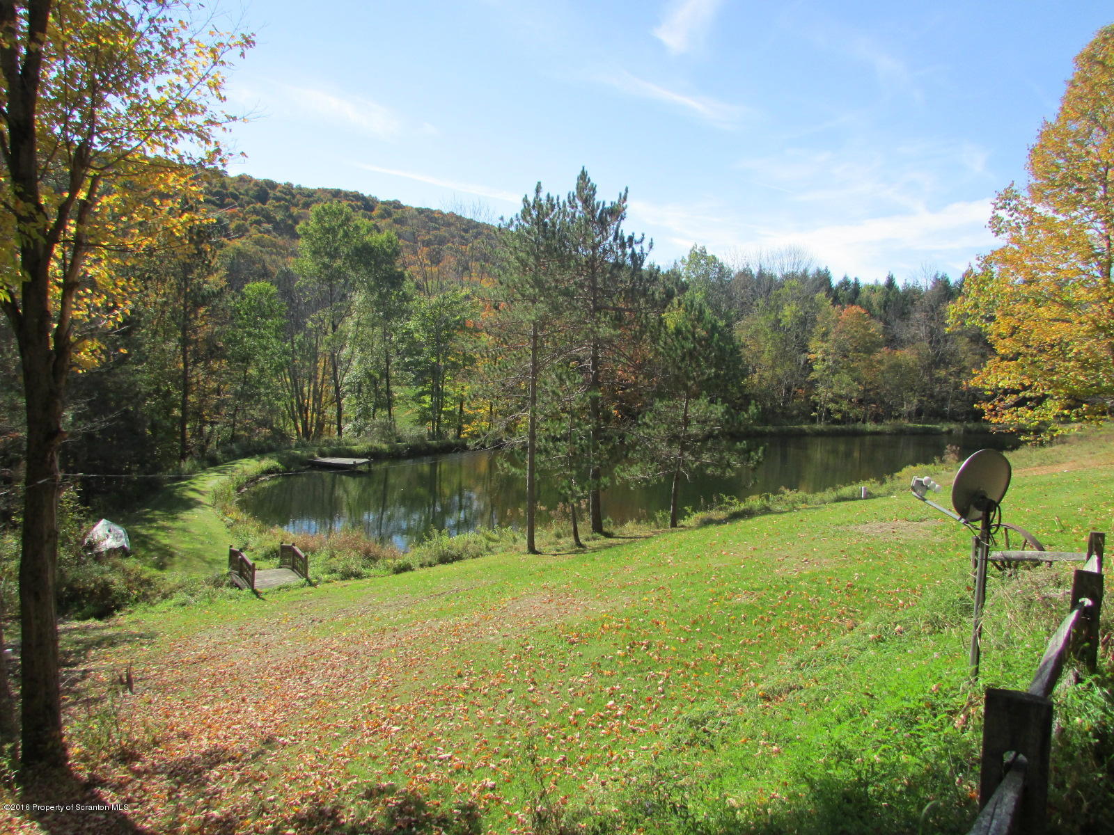 1291 Conroy Road Montrose, PA 18801 - Photo 5 of 34 a view of a lake in middle of forest