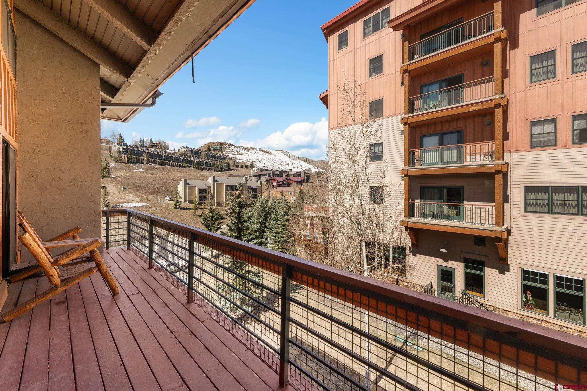 11 Emmons Road, Unit 433 Crested Butte, CO 81225 - Photo 11 of 32 a view of balcony with furniture and wooden floor