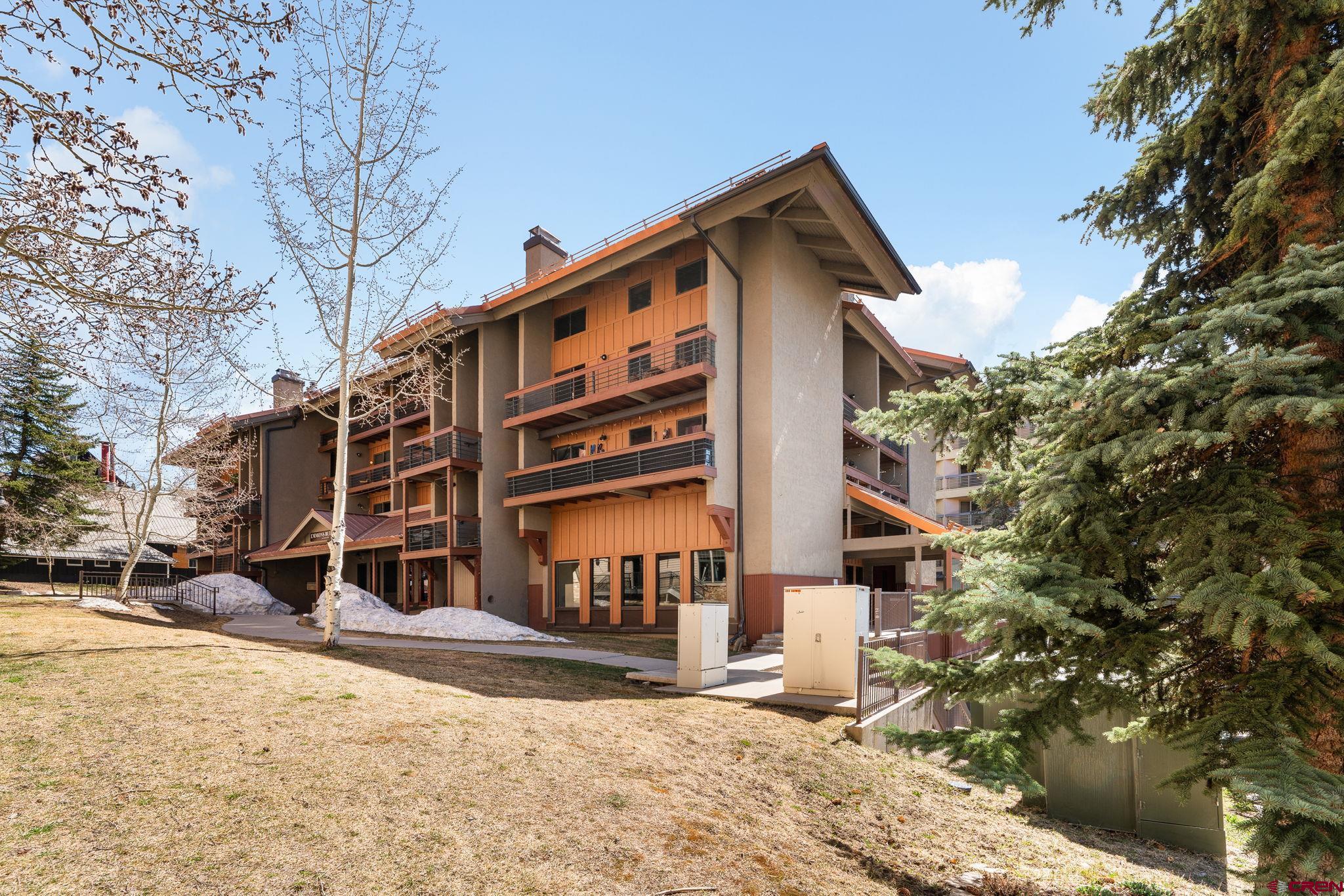 11 Emmons Road, Unit 433 Crested Butte, CO 81225 - Photo 21 of 32 a view of a house with a yard