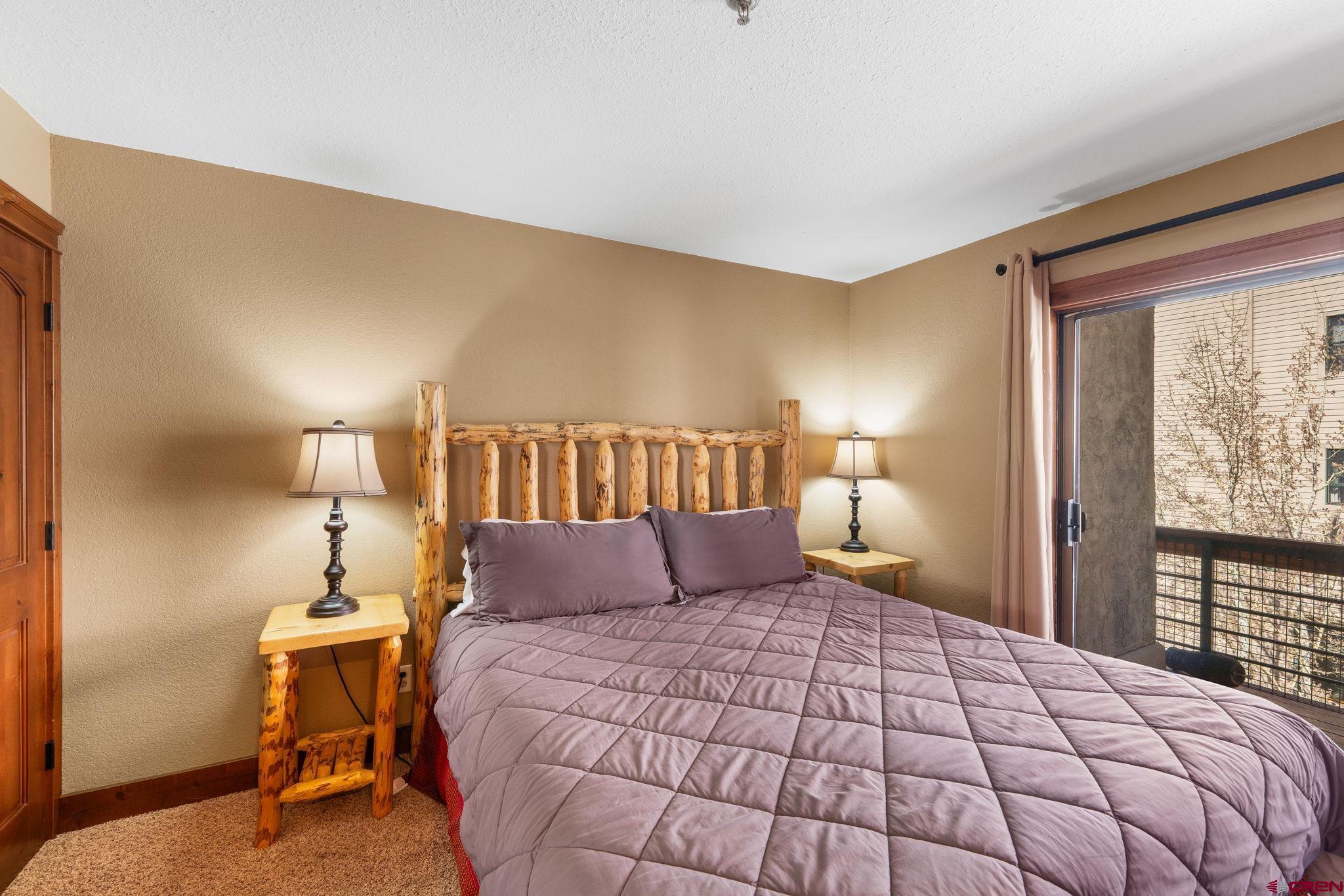 11 Emmons Road, Unit 433 Crested Butte, CO 81225 - Photo 8 of 32 a bedroom with a bed and window