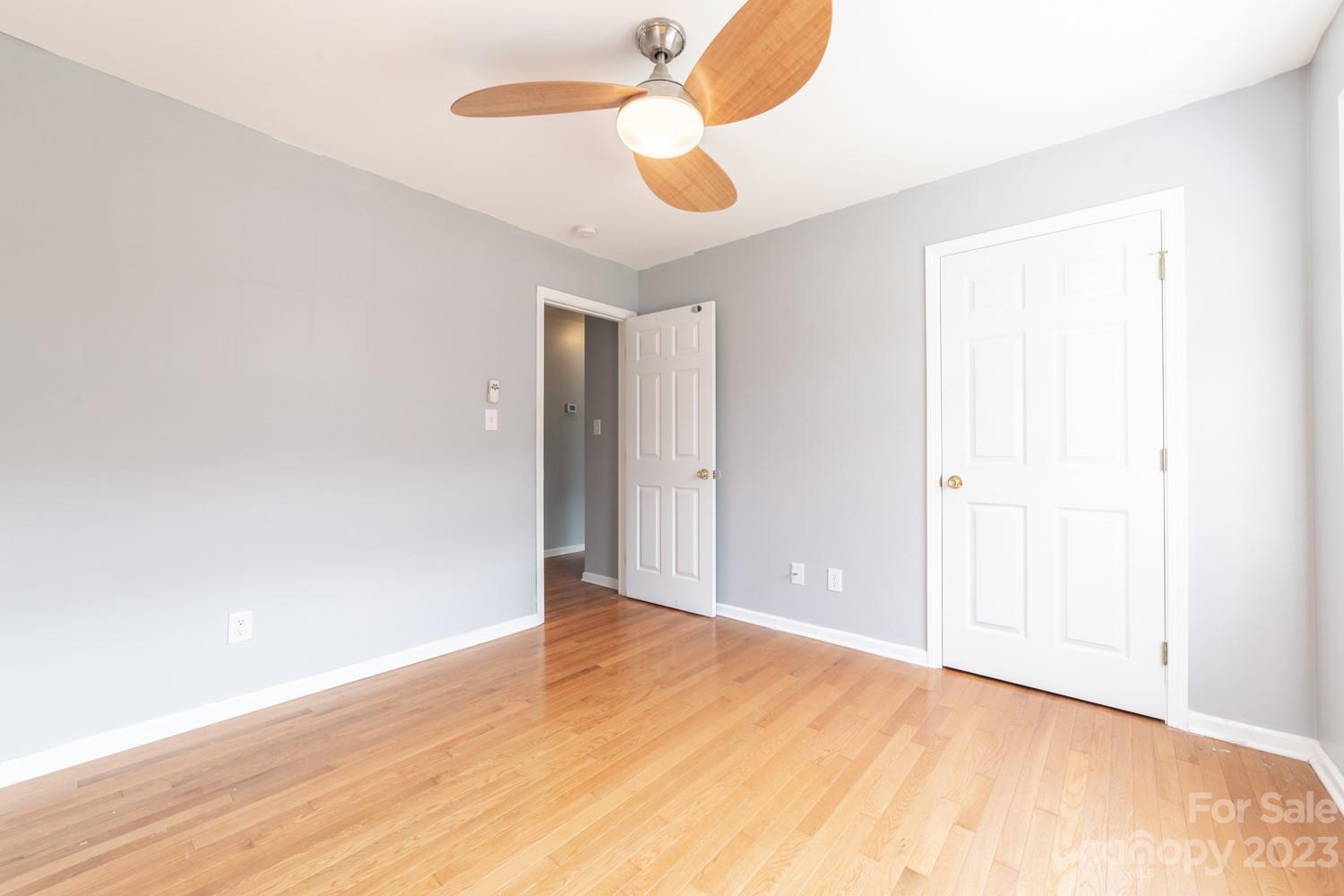 327 Unity Church Road Kings Mountain, NC 28086 - Photo 17 of 30 an empty room with wooden floor and windows