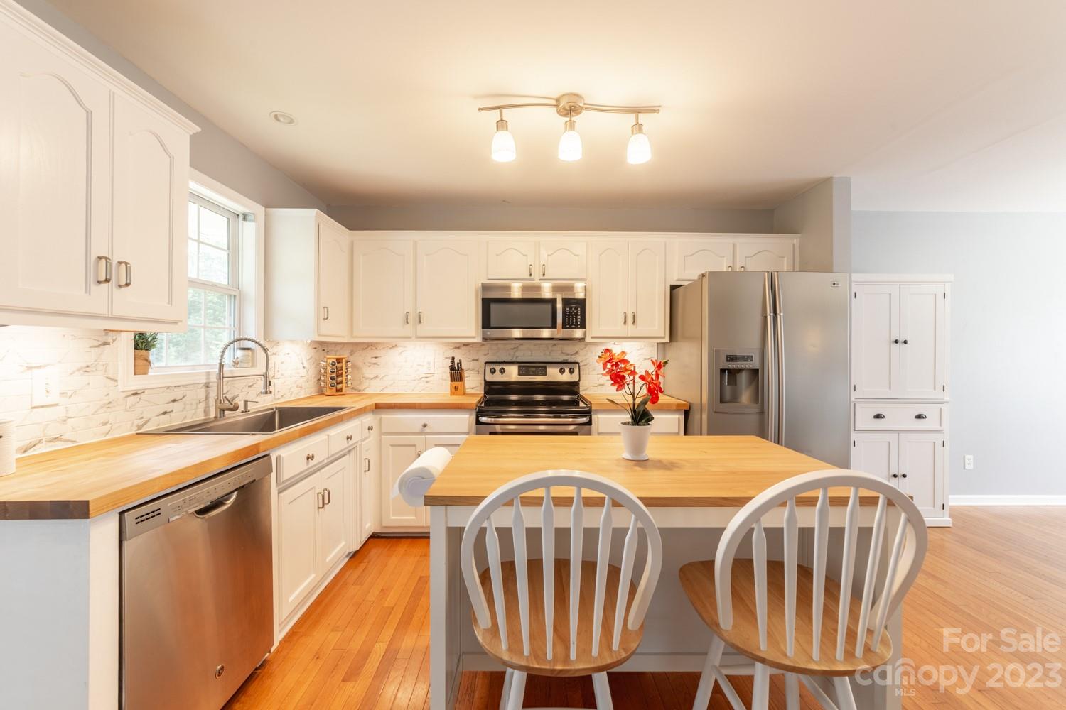 327 Unity Church Road Kings Mountain, NC 28086 - Photo 7 of 30 a kitchen with a sink appliances and cabinets