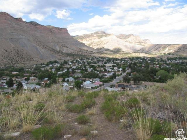 700 Spring Canyon Road Helper, UT 84526 - Photo 14 of 19 Expansive landscape featuring an elevated perspective of a town nestled within a mountainous terrain
