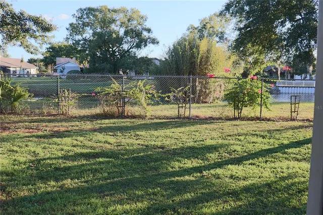 a view of a house with yard and sitting area