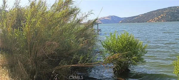 a view of a lake with a mountain in the background